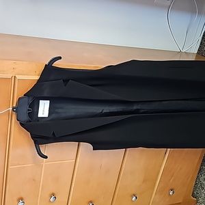 Black sleeveless duster